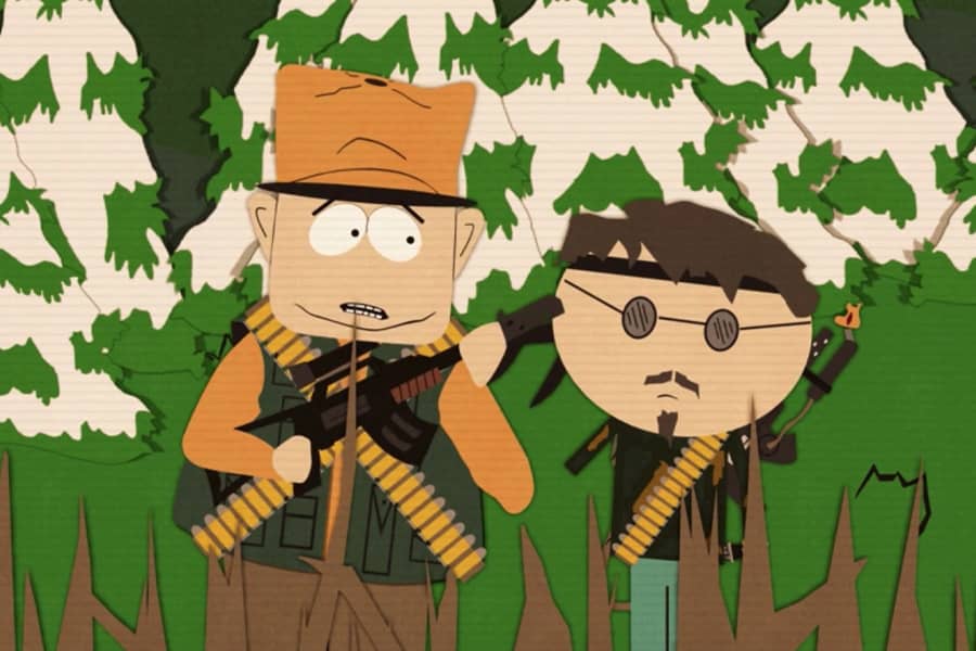 Jimbo and Ned with guns in the woods