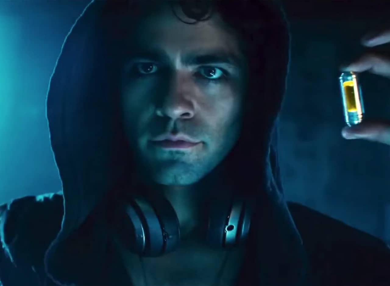 Vincent Chase as Hyde in a hoodie, holding up a small vial of glowing liquid