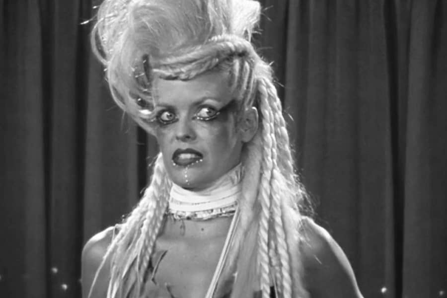 blonde woman looking scared