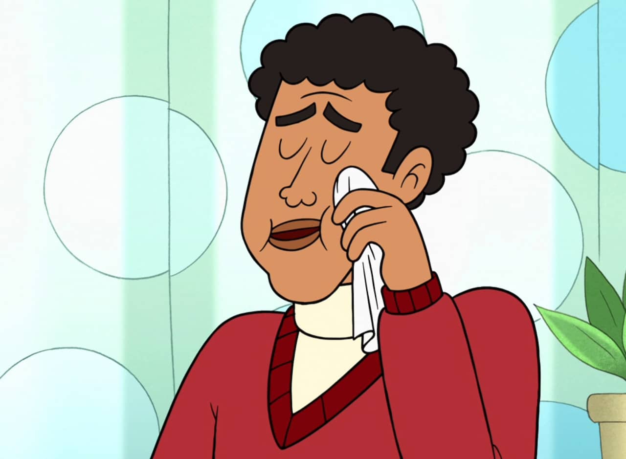 host Flannery Shedlawn wiping away a tear with a tissue