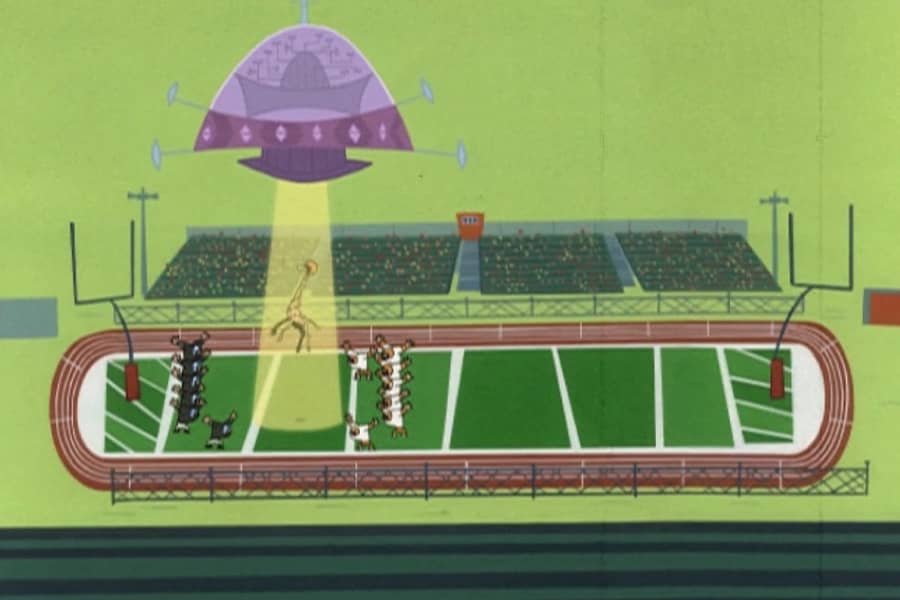 above the football field, an alien spaceship beams up the giraffe