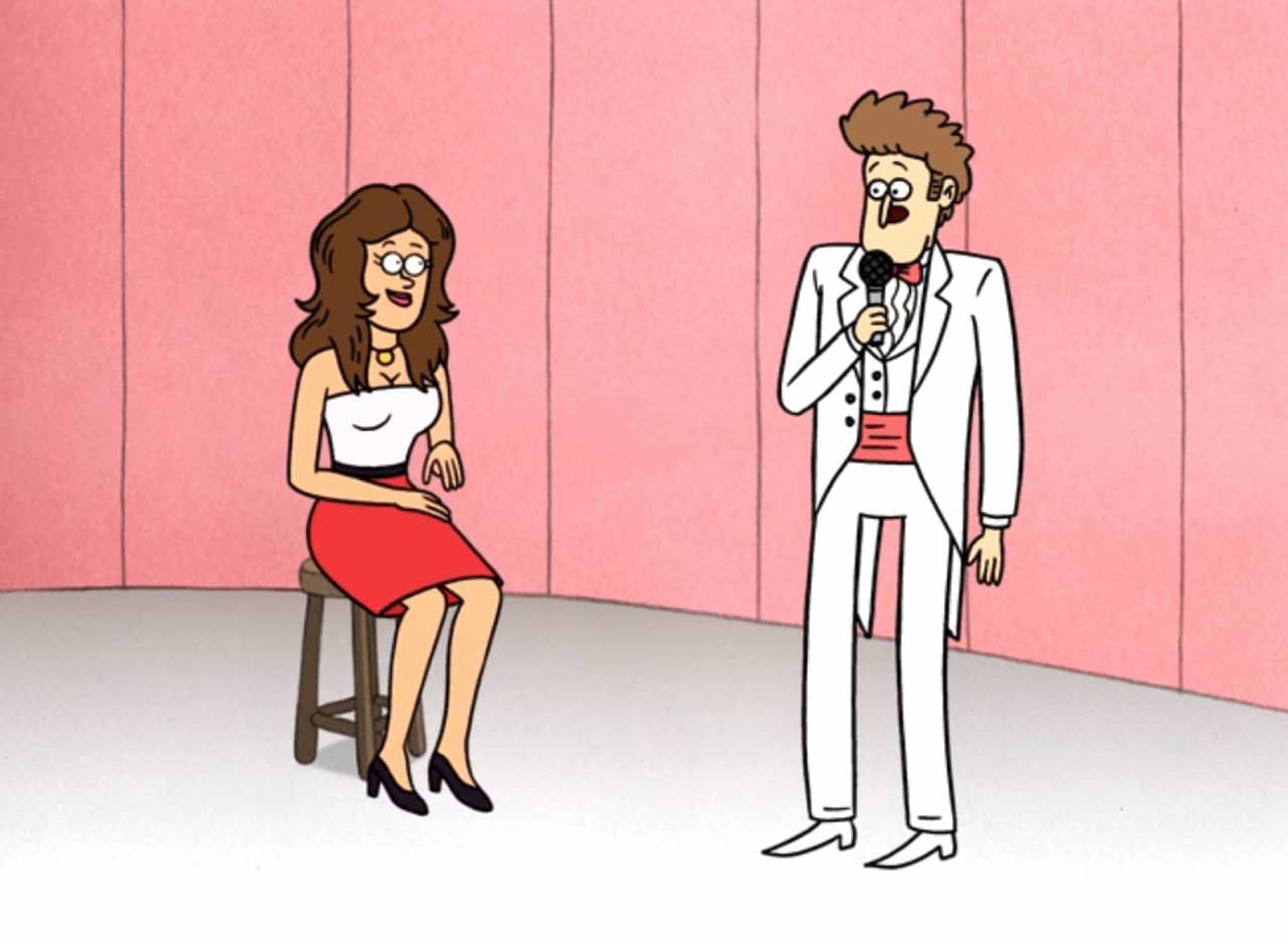 host Bob Karpett in a white tuxedo next to a lady