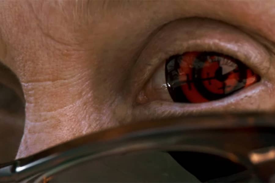 closeup of a man’s eye that looks like a scope‘s crosshairs
