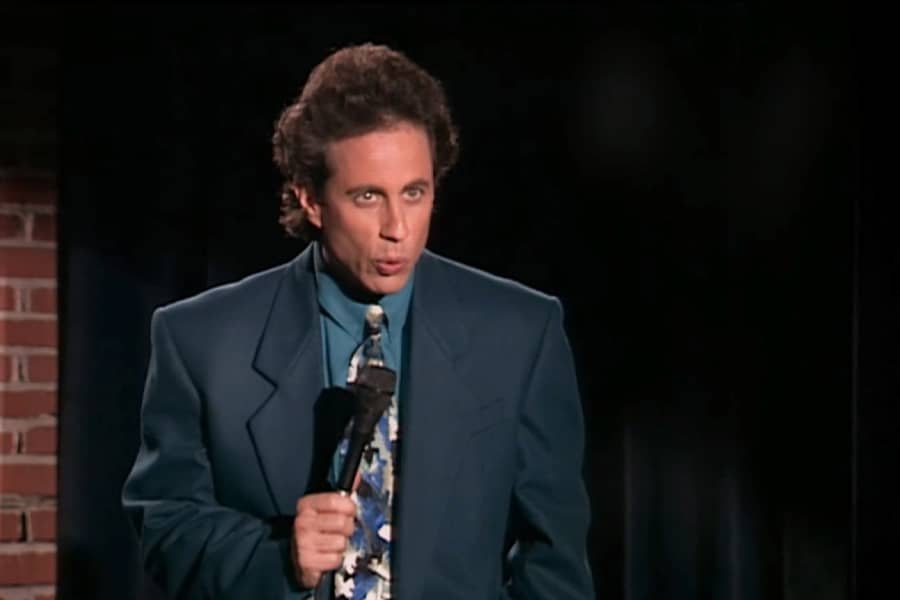 Jerry doing standup in a comedy club