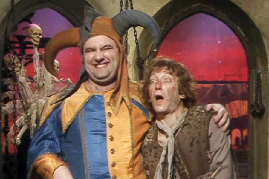 Bolawski smiling with a guest dressed as a peasant