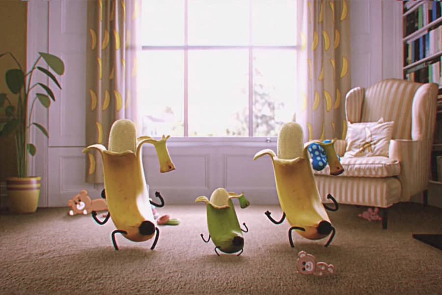 mom, dad, and baby banana dancing from behind