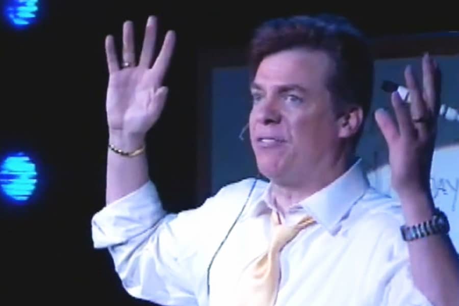Tibbons with his hands in the air