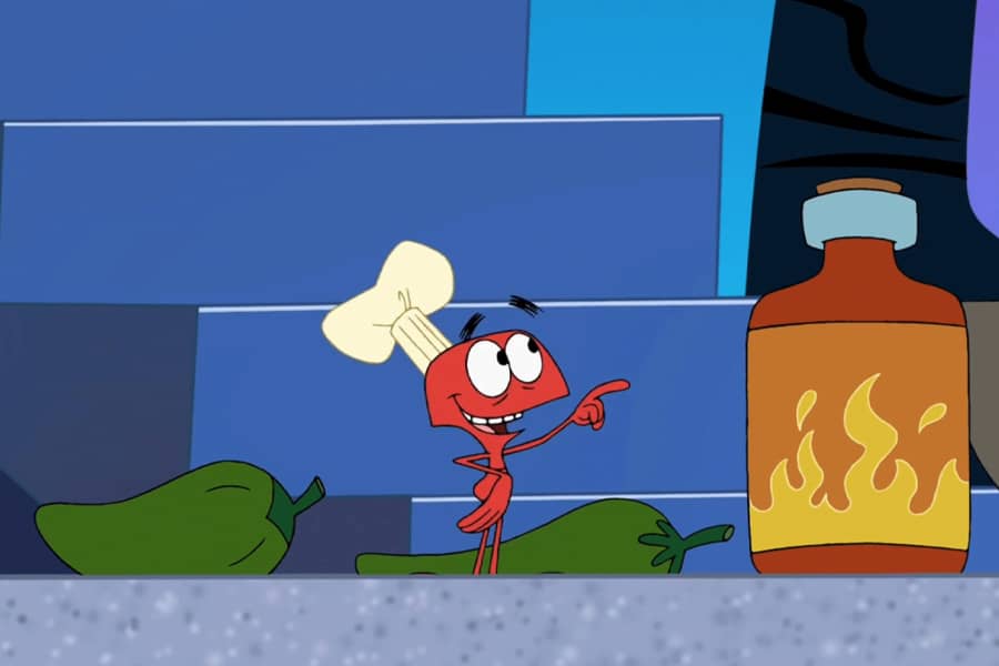 ant chef next to some hot sauce