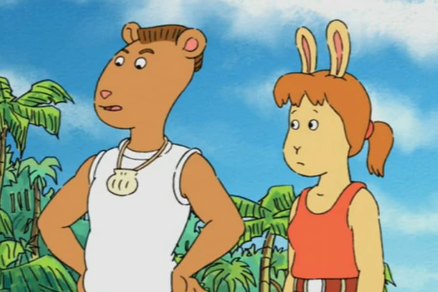 two teens talk with jungle in the background