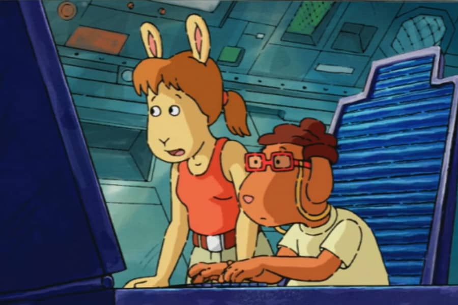 two teens are on a computer in a laboratory