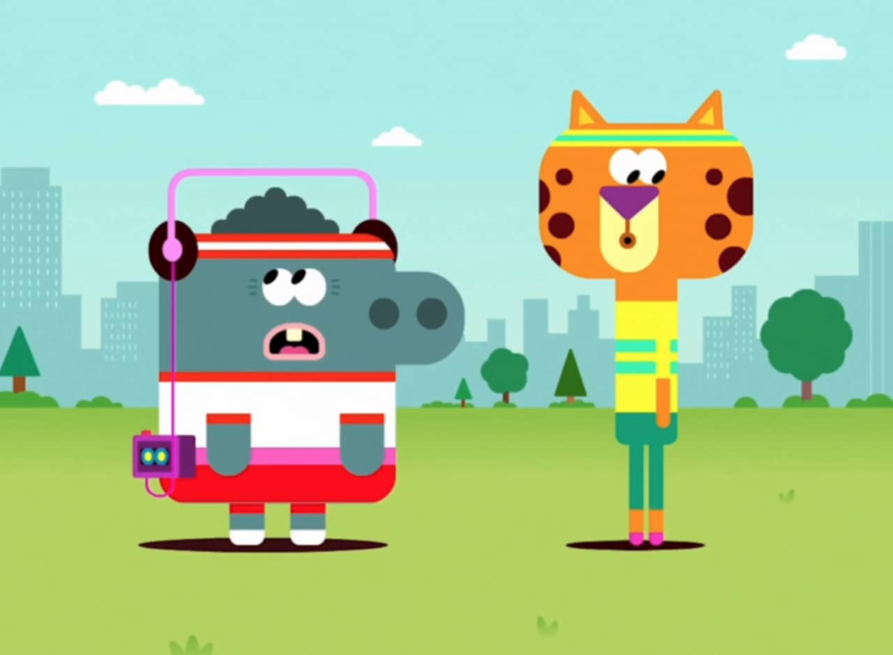 a hippo and cheetah in workout clothes in the park standing awkwardly