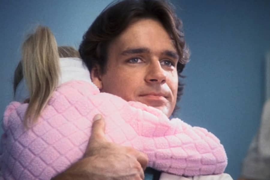 Dr. Chambers hugging a child