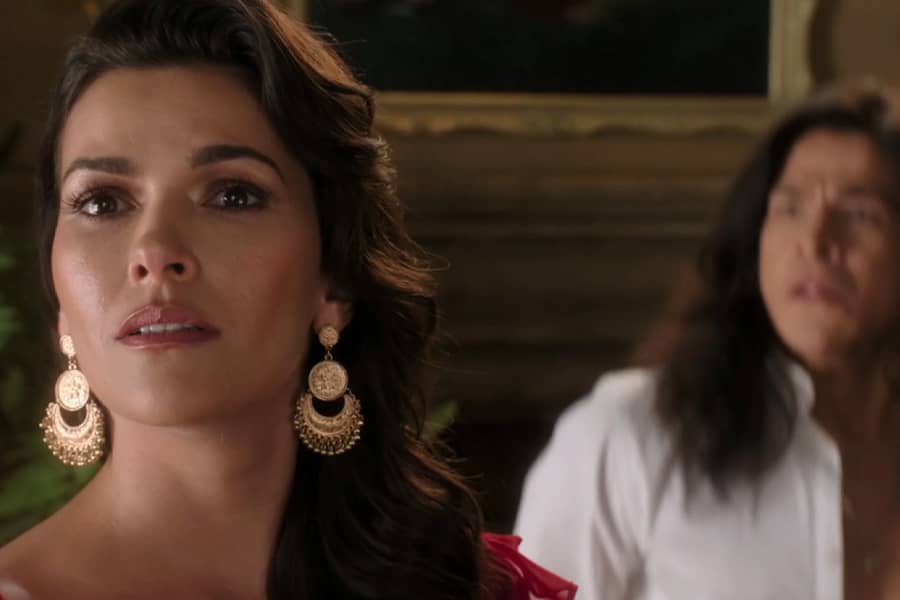 Gabriella looks away as Juan approaches her