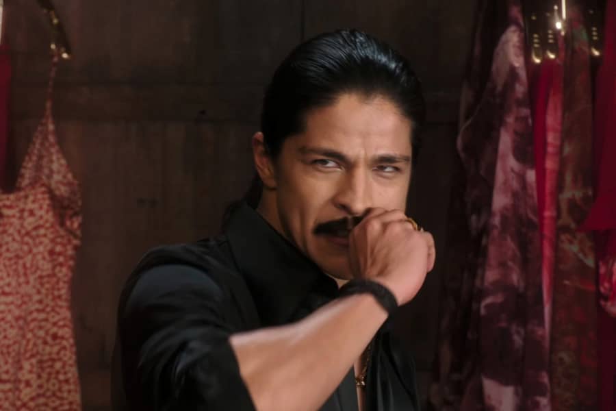 Pablo, Juan’s twin, pulls off a false mustache