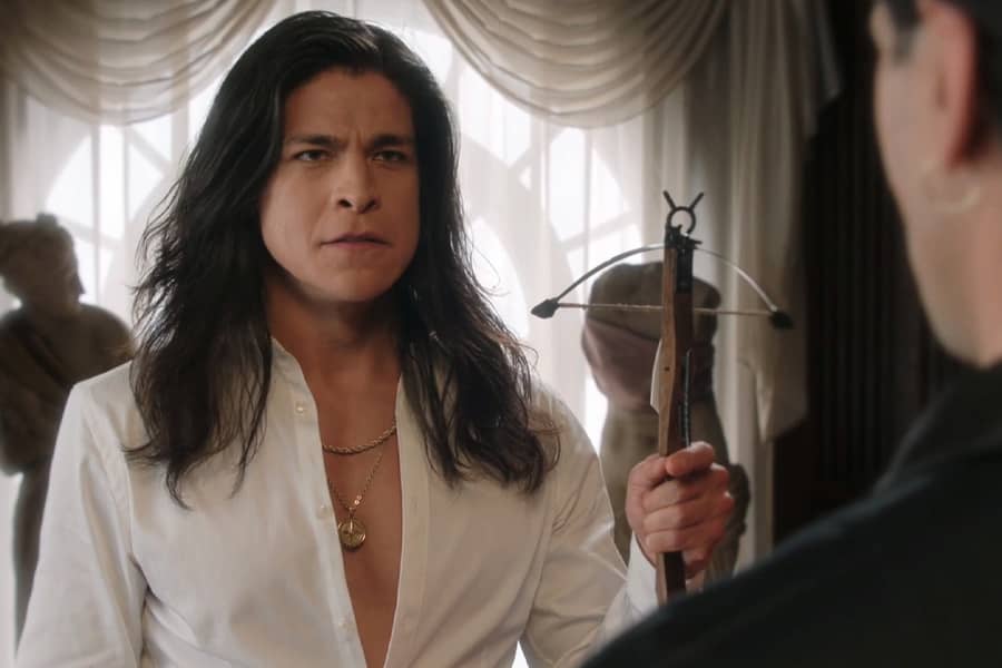 Juan holds up a mini crossbow