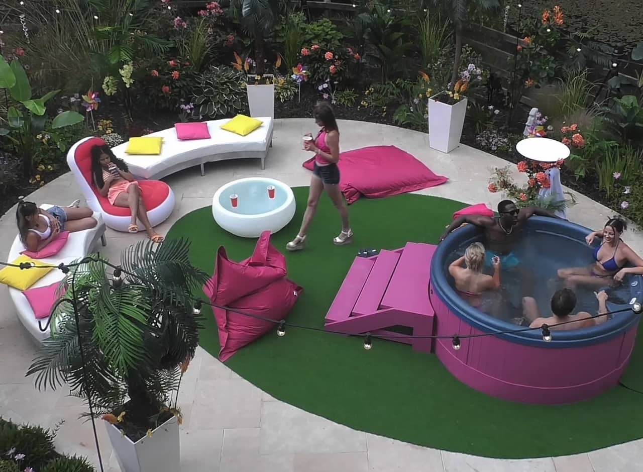 a bunch of people lounging in a hot tub