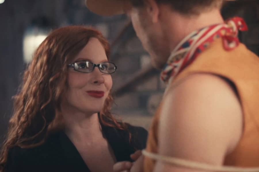 woman smiles at the cowboy