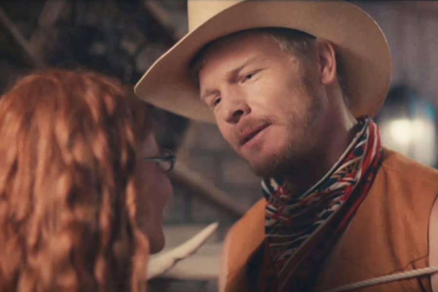 the cowboy looks at the woman