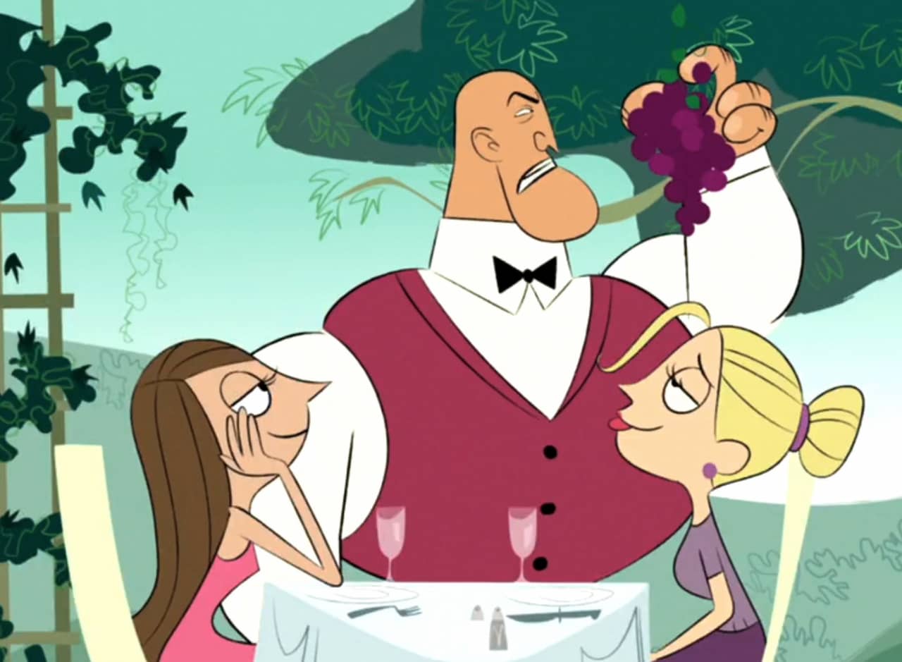 Rod Tango as a waiter sniffing some grapes next to a table with two women