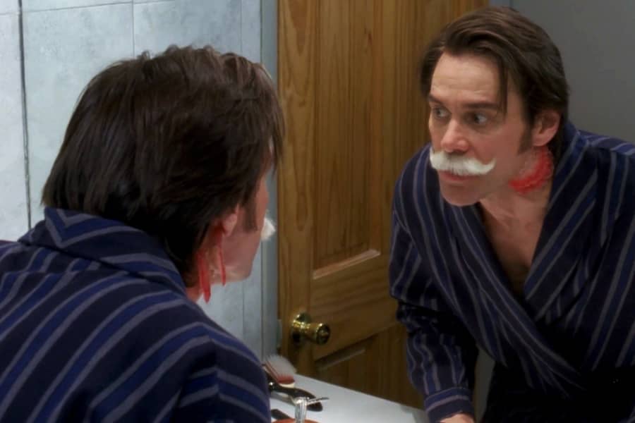 Dave, still in his bathrobe, first sees the mustache and gills in the bathroom mirror