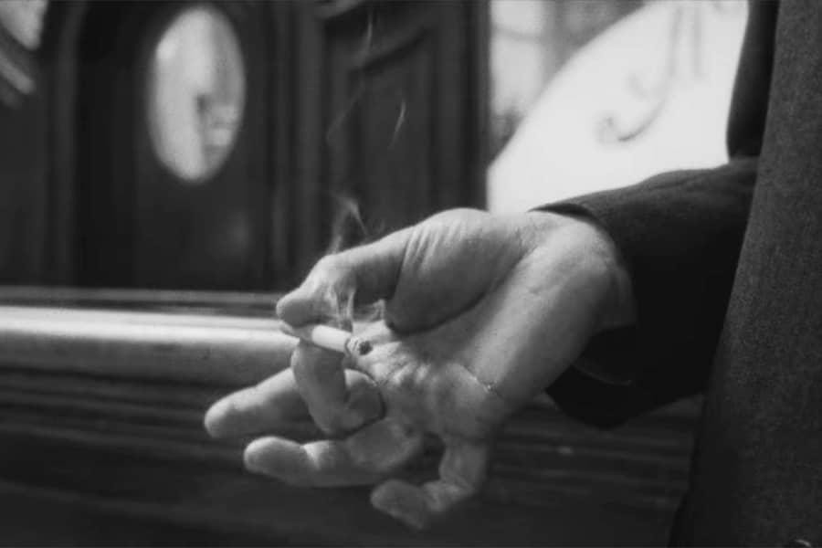 hand holding a cigarette