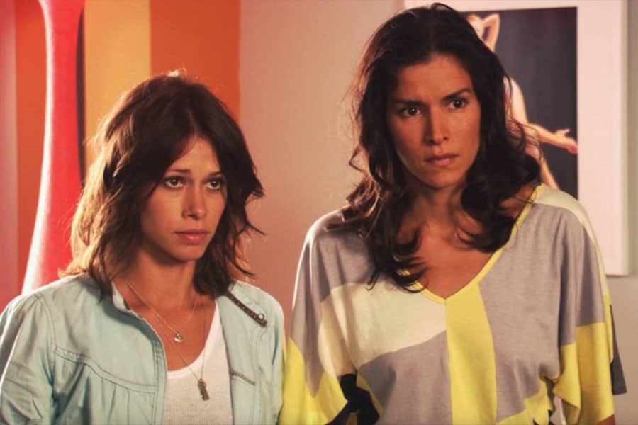 two brunette women look concerned