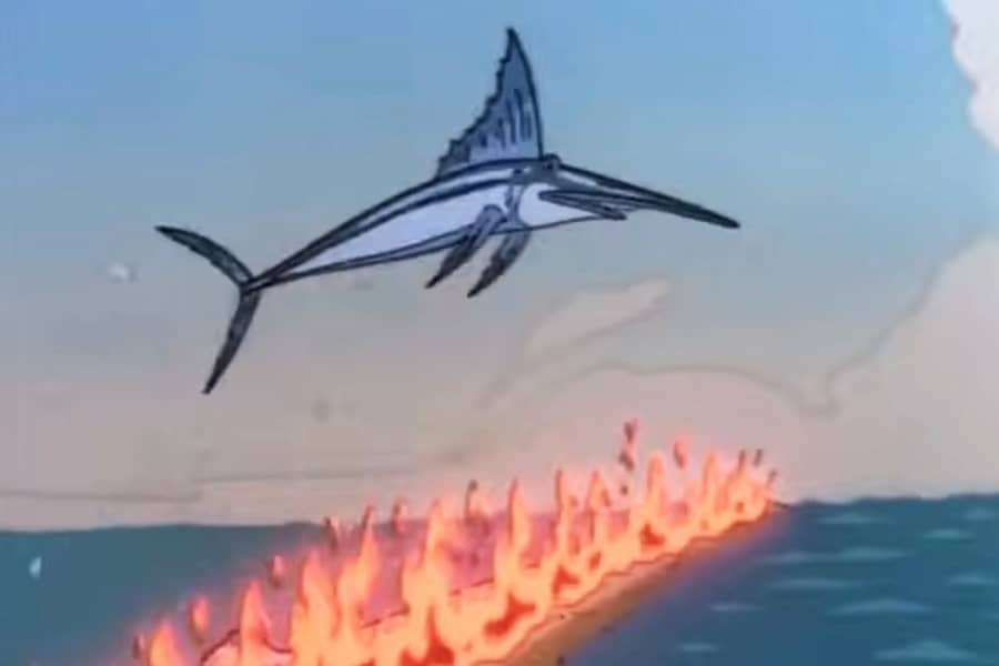 marilin jumping over a fire on the ocean water
