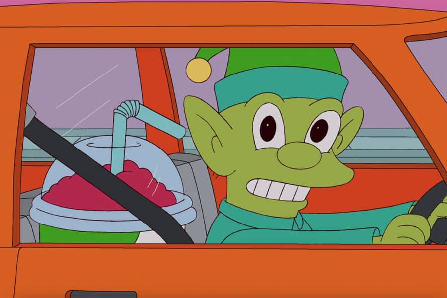 elf in a car next to a giant slurpee