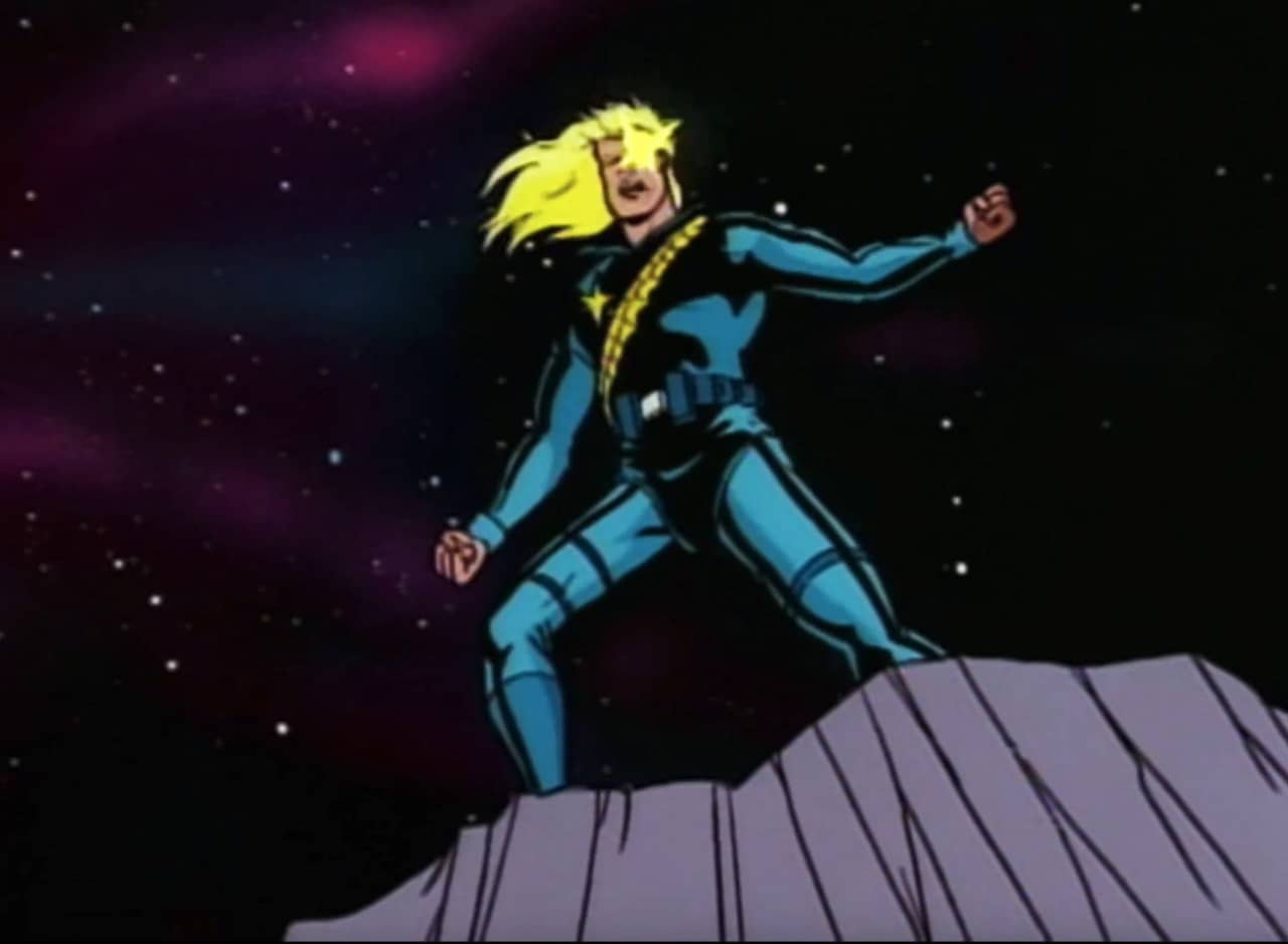 Longshot, a blonde superhero atop a cliff