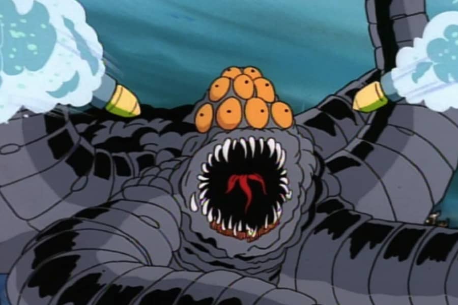 multi-eyed sea monster about to be exploded by two missiles