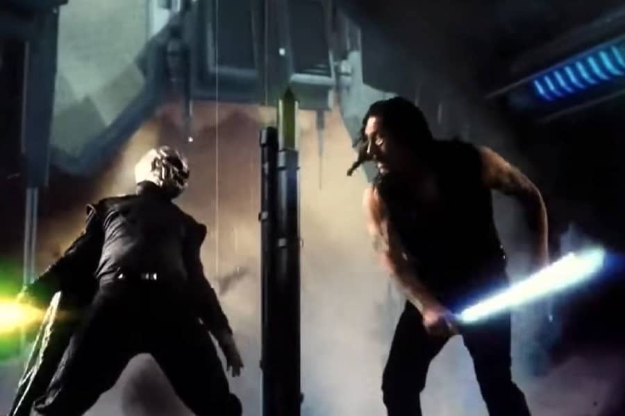 Machete and the Man in the Silver Mask fight with glowing weapons