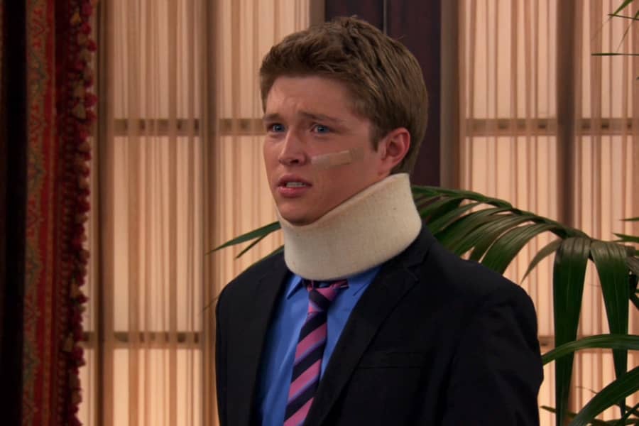 Mackenzie wearing a neckbrace and eye bandage
