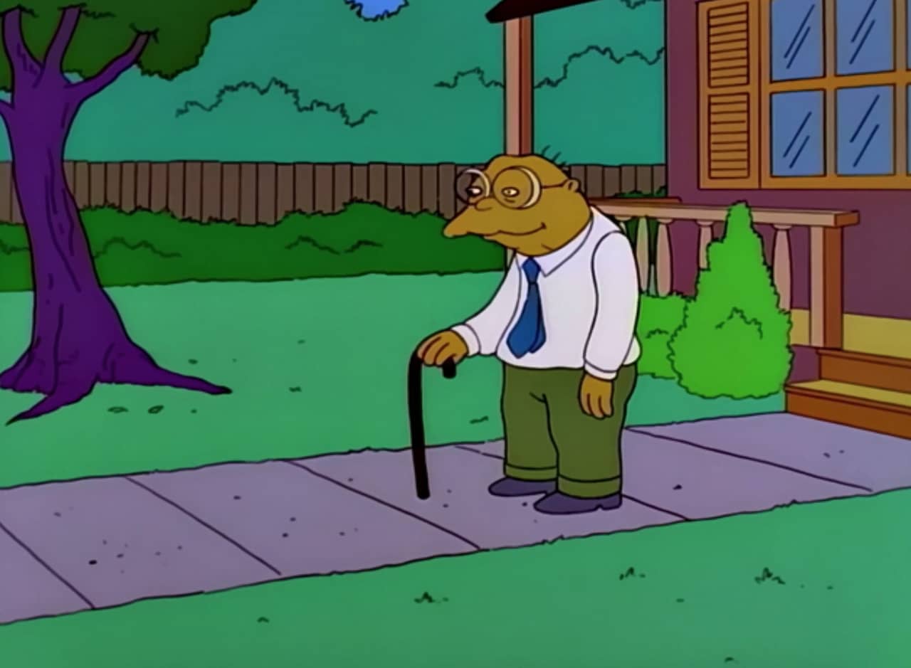 Hans Moleman stands outside his house