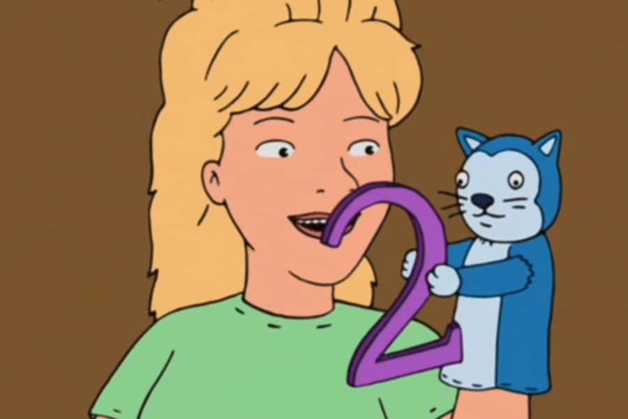 Luanne’s cat puppet holds up the number 2
