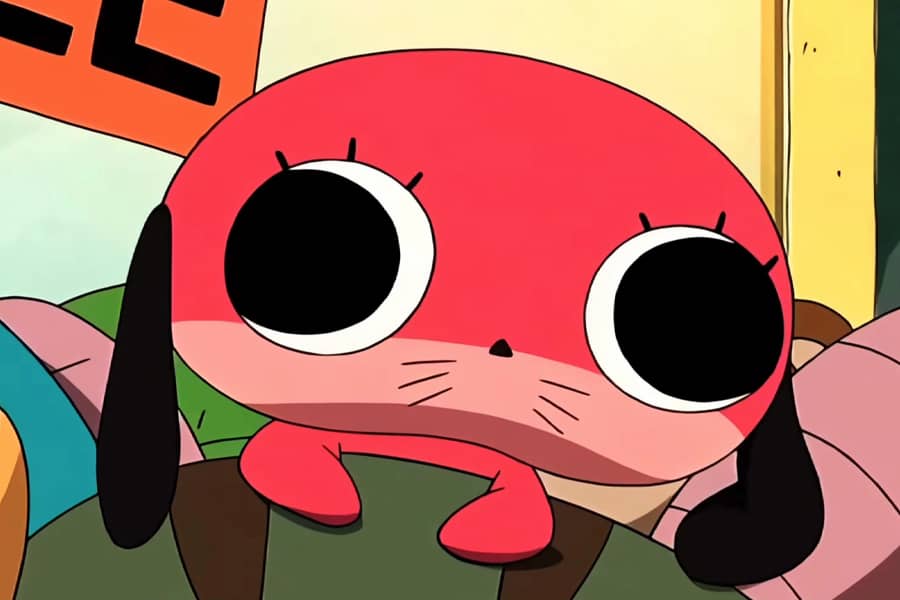Maromi emerging from a basket of toys