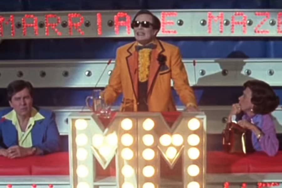 Bert on stage with two contestants