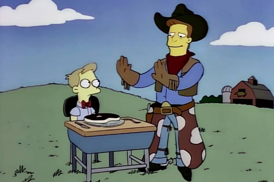 McClure with the boy who has a steak on a plate