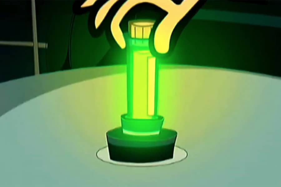 hand placing glowing green test tube on a table