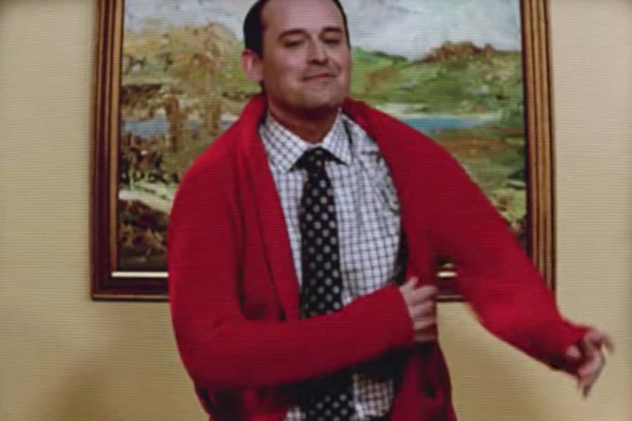 Mr. Parker puts on a red sweater