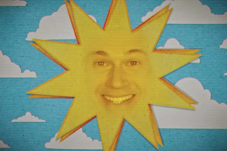 a sun with a smiling human face