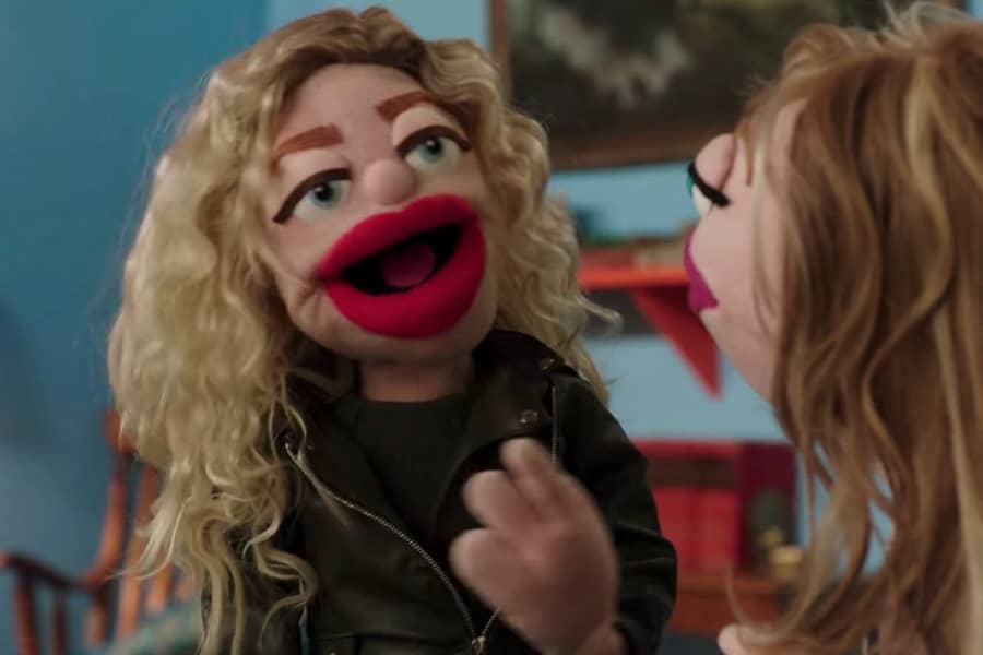 two female puppets talk to each other 