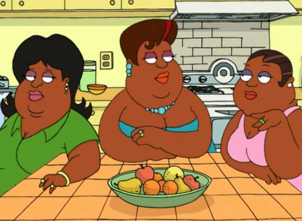 three Black women sitting at a kitchen table