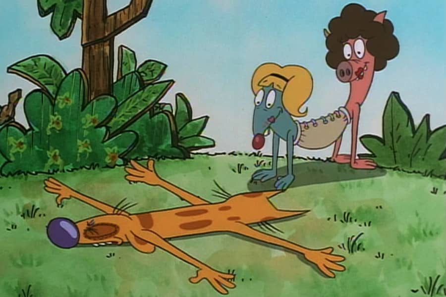CatDog lying facedown on the grass near another CatDog-like creature (two other animals tied together in the middle)