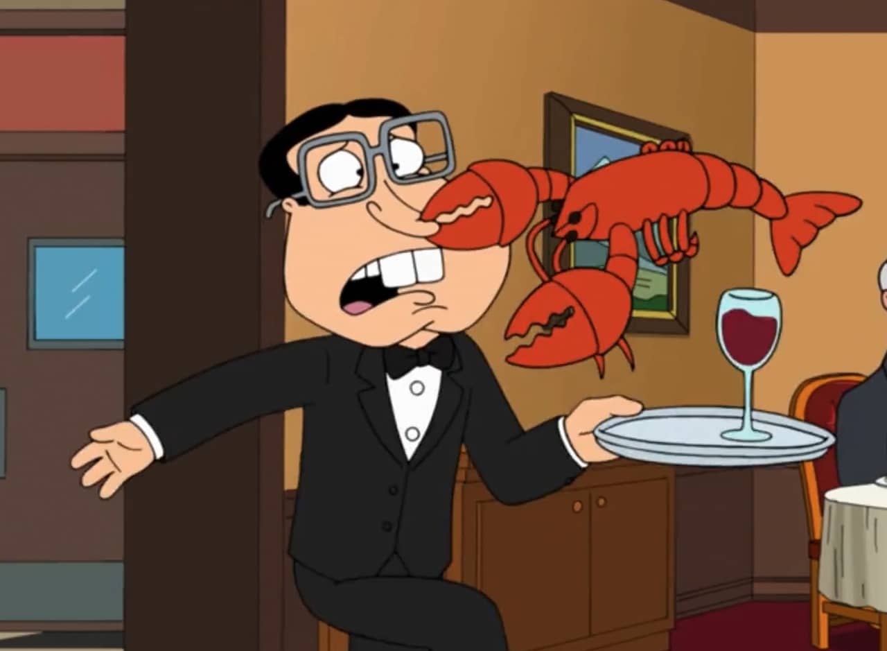 Glenn Quagmire, with glasses and big buck teeth, as a waiter getting his nose clamped by a lobster