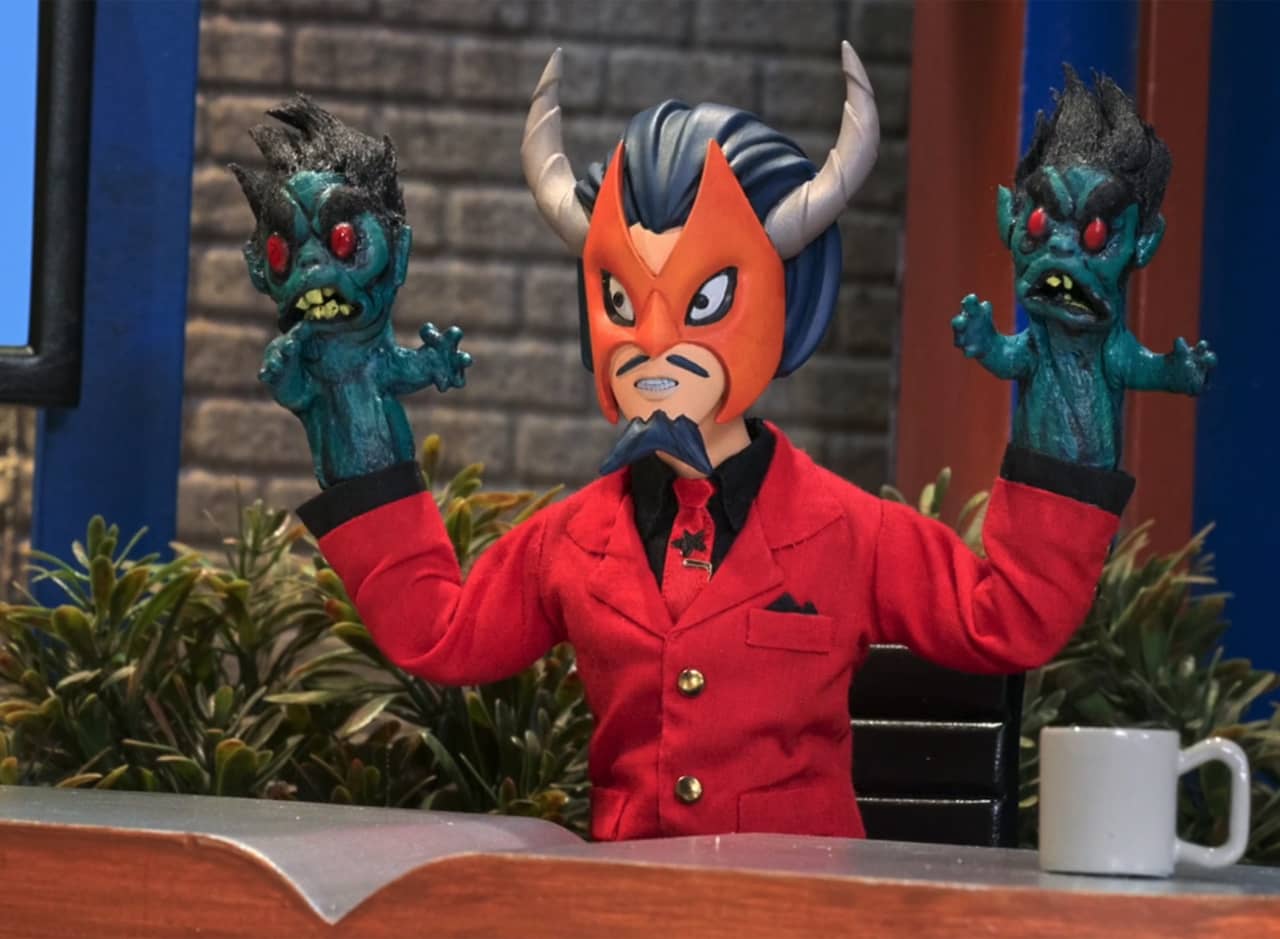 Master Pandemonium, a man wearing a mask with horns, who has two demon hands