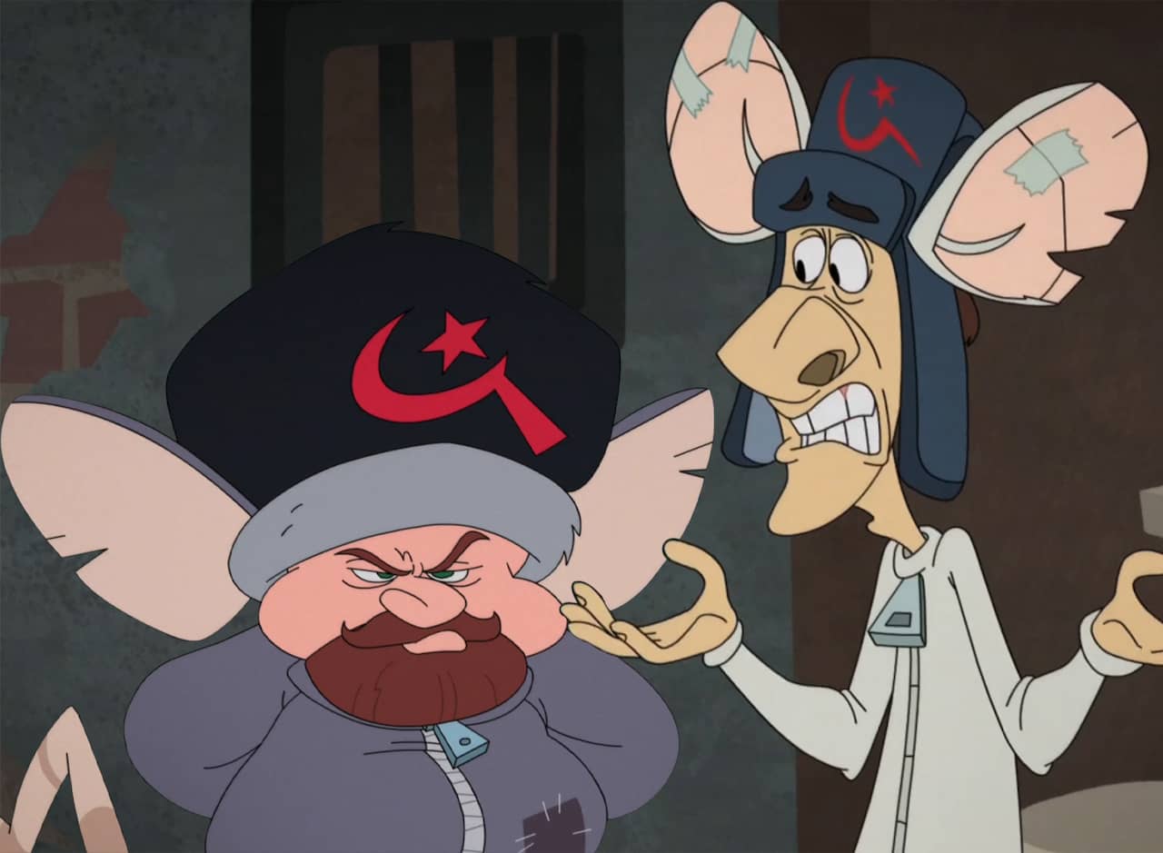 thin, tall human man and short, round man both dressed as rats and wearing Russian hats
