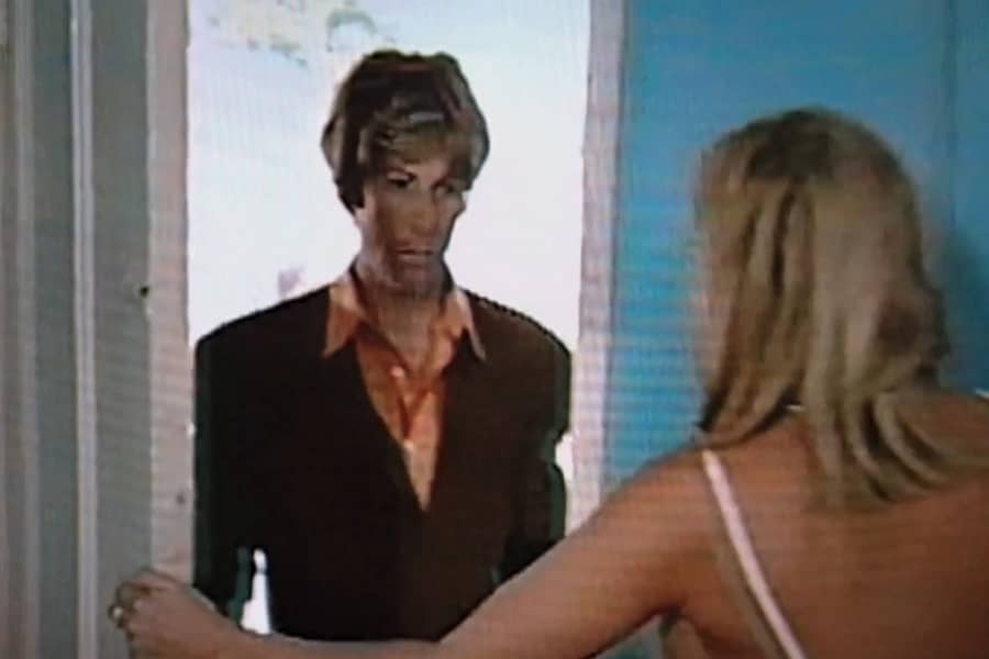 a woman opens motel room door and Gil Bang is outside