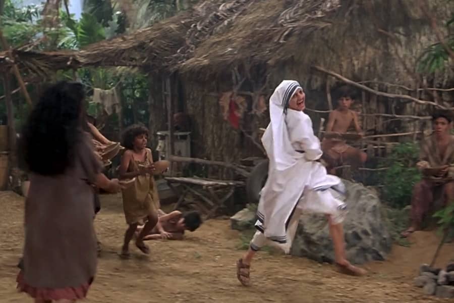 Mother Teresa dancing and running with the crutch, a hungry child behind her