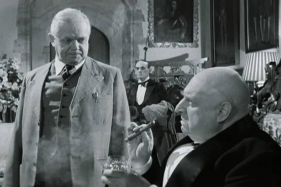 inspector speaks to bald man smoking a cigar