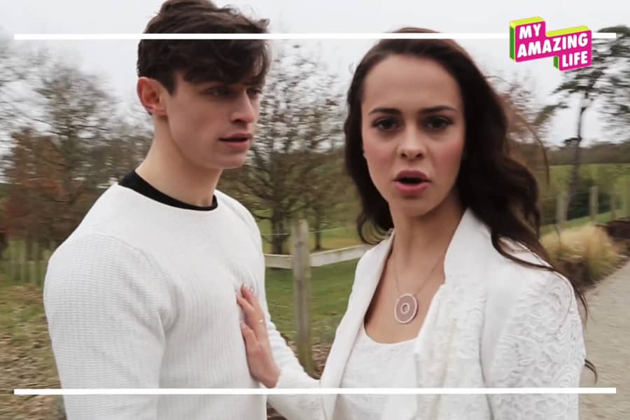 Danielle with her hand on a guy’s chest